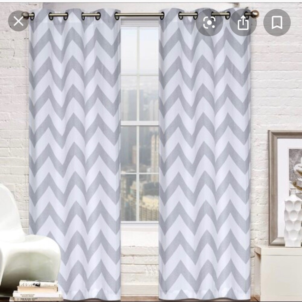 Two gray and white zigzag curtains